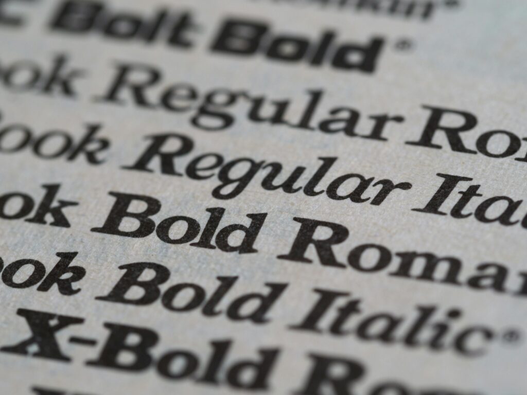 Detailed view of different font styles printed on paper, showcasing typography.